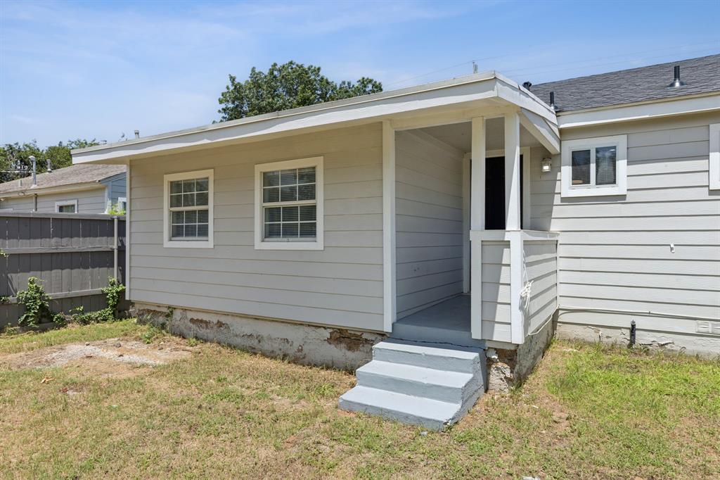 3226 Inwood Road Dallas, TX 75235 - Photo 22 of 25 a view of a house with backyard and wooden fence