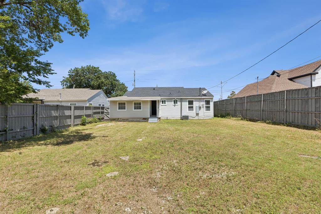 3226 Inwood Road Dallas, TX 75235 - Photo 24 of 25 a front view of a house with a yard