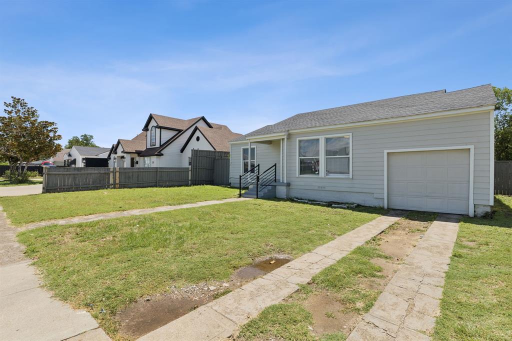 3226 Inwood Road Dallas, TX 75235 - Photo 5 of 25 a view of a house with backyard and tree