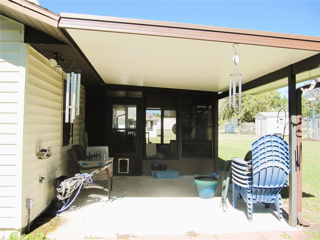 11815 Southeast 84 Avenue Belleview, FL 34420 - Photo 23 of 23 a room with furniture and a large window