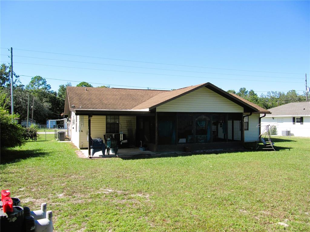 11815 Southeast 84 Avenue Belleview, FL 34420 - Photo 8 of 23 a view of a house with a yard and sitting area