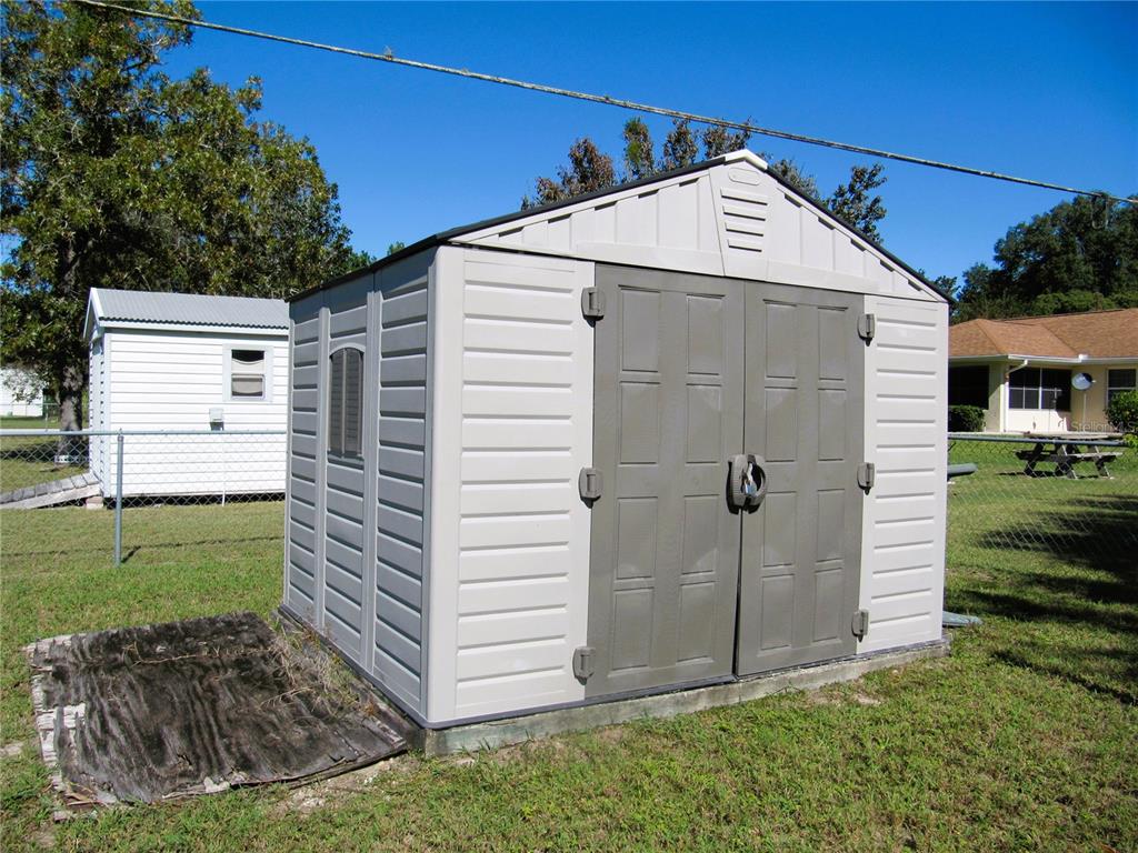 11815 Southeast 84 Avenue Belleview, FL 34420 - Photo 10 of 23 a view of a house with a yard