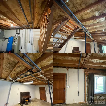a view of a house with a yard chairs and table
