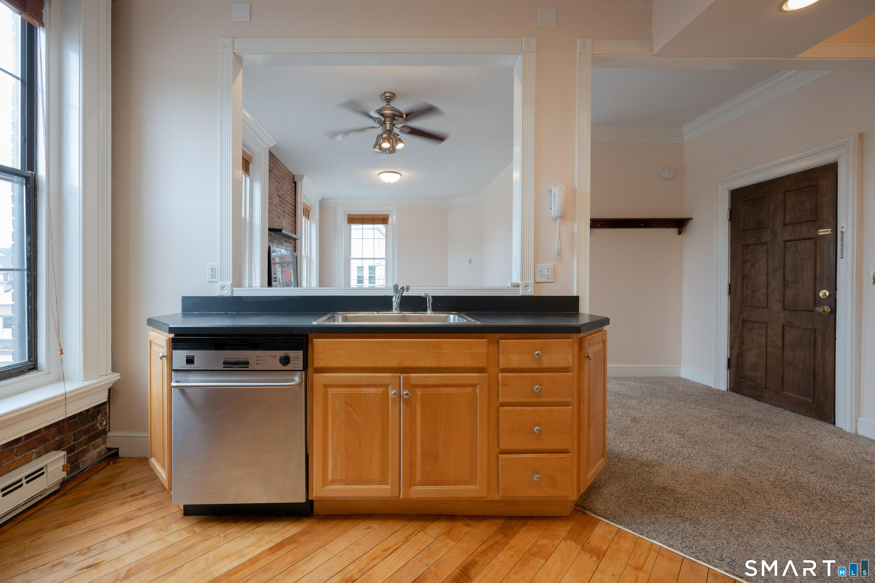 130 Main Street, Unit 2D Canton, CT 06019 - Photo 10 of 25 a kitchen with stainless steel appliances granite countertop a stove a sink and a refrigerator