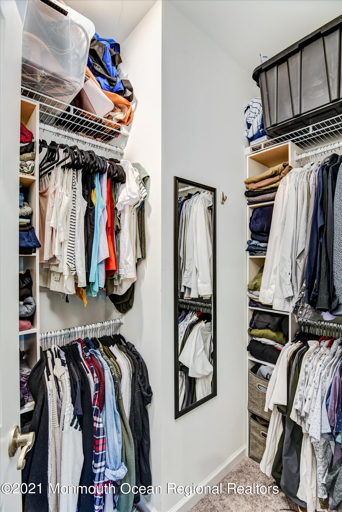 112 Revival Road, Unit 2012 Brick, NJ 08723 - Photo 16 of 22 a view of walk in closet with clothes and shoes