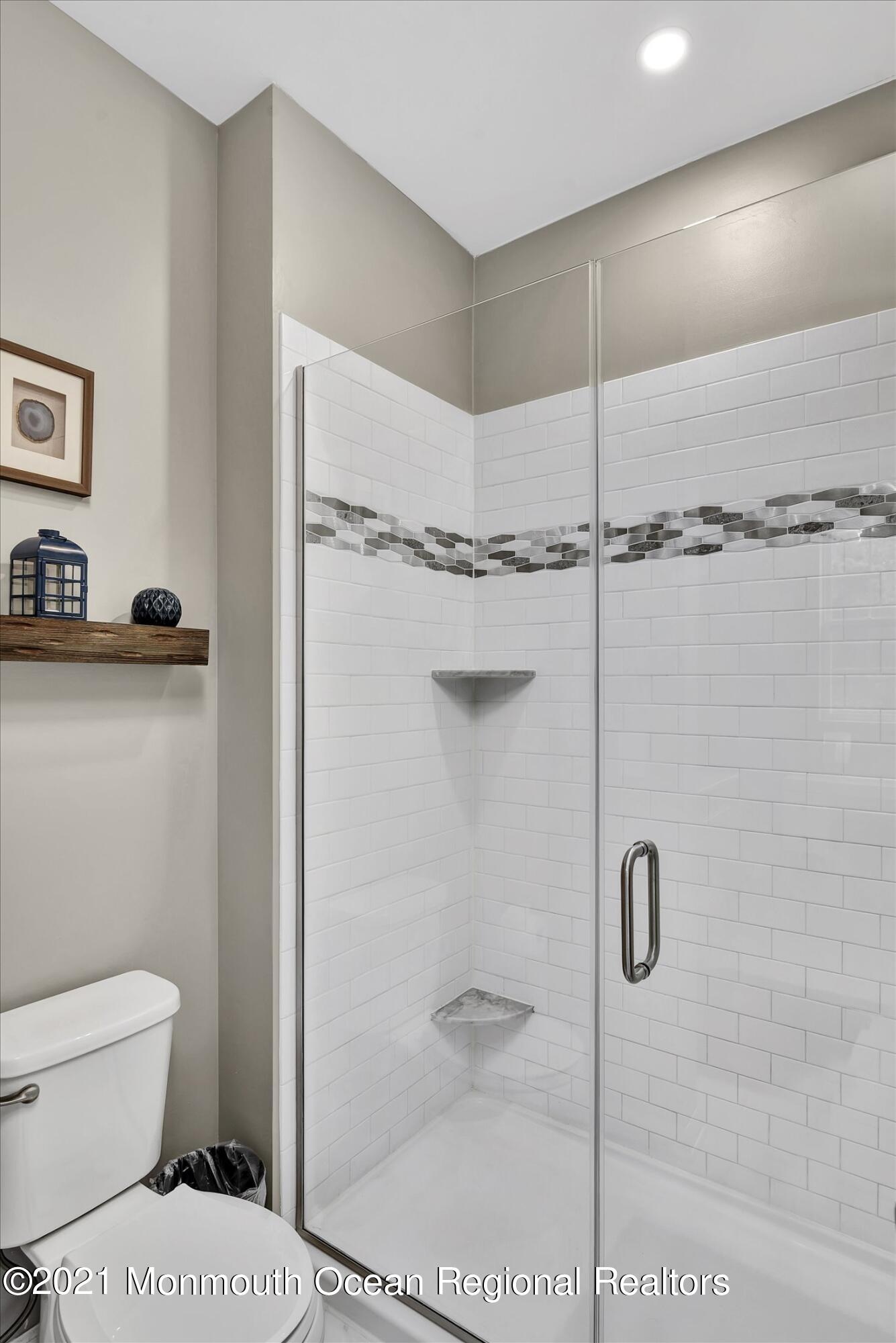 112 Revival Road, Unit 2012 Brick, NJ 08723 - Photo 18 of 22 a bathroom with a toilet and a shower