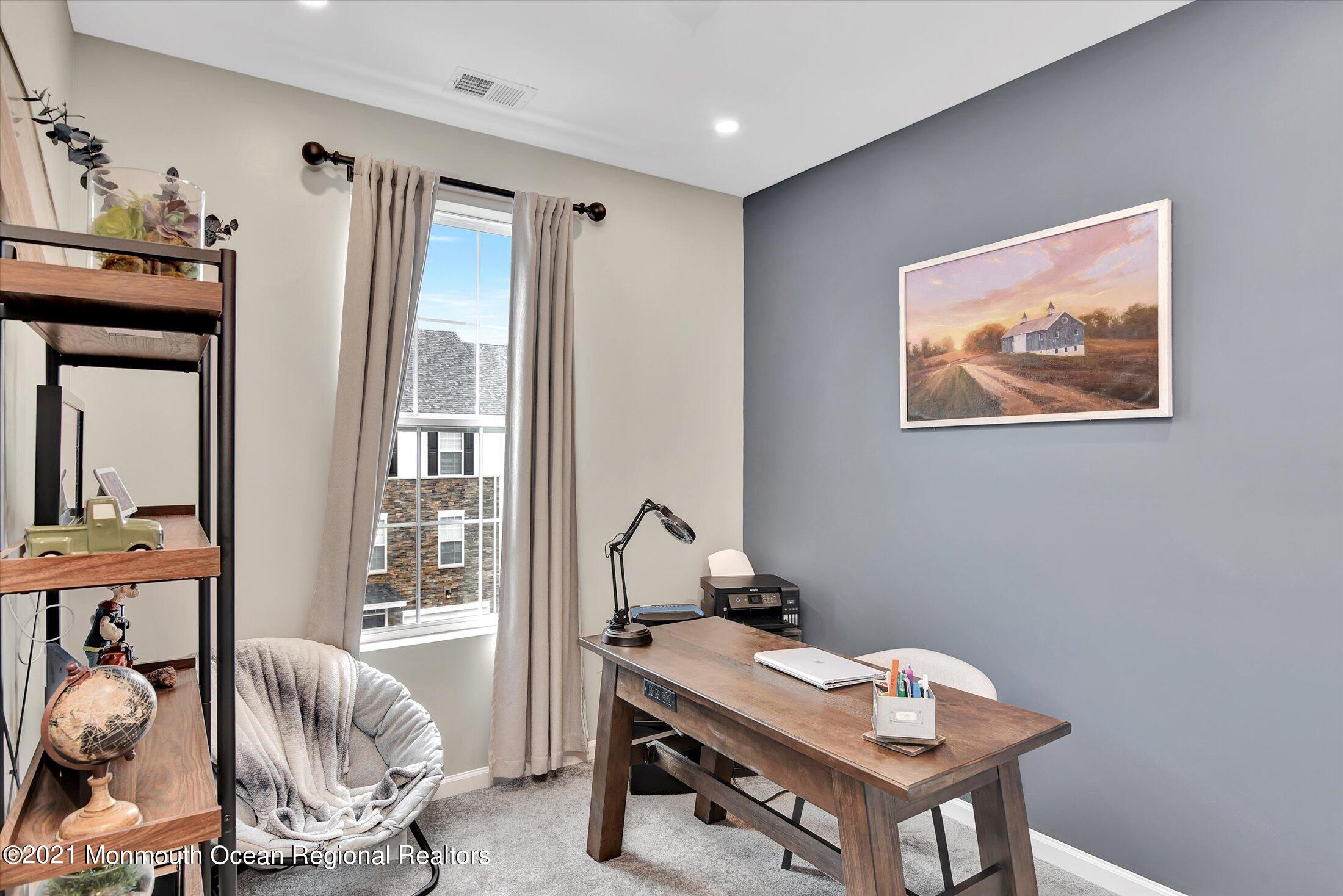112 Revival Road, Unit 2012 Brick, NJ 08723 - Photo 19 of 22 a room with furniture and large windows