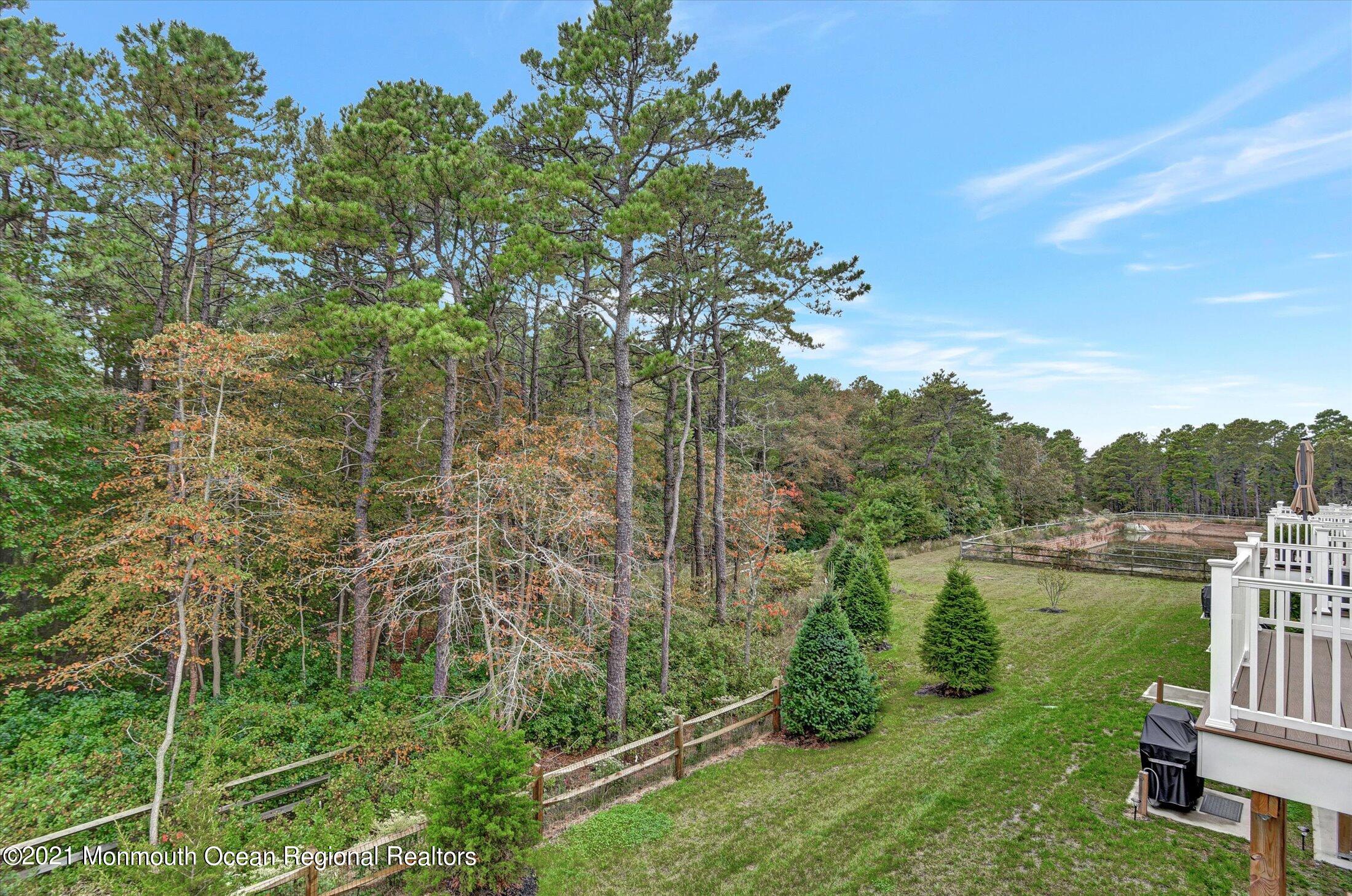 112 Revival Road, Unit 2012 Brick, NJ 08723 - Photo 6 of 22 a view of a lake with a house in the background