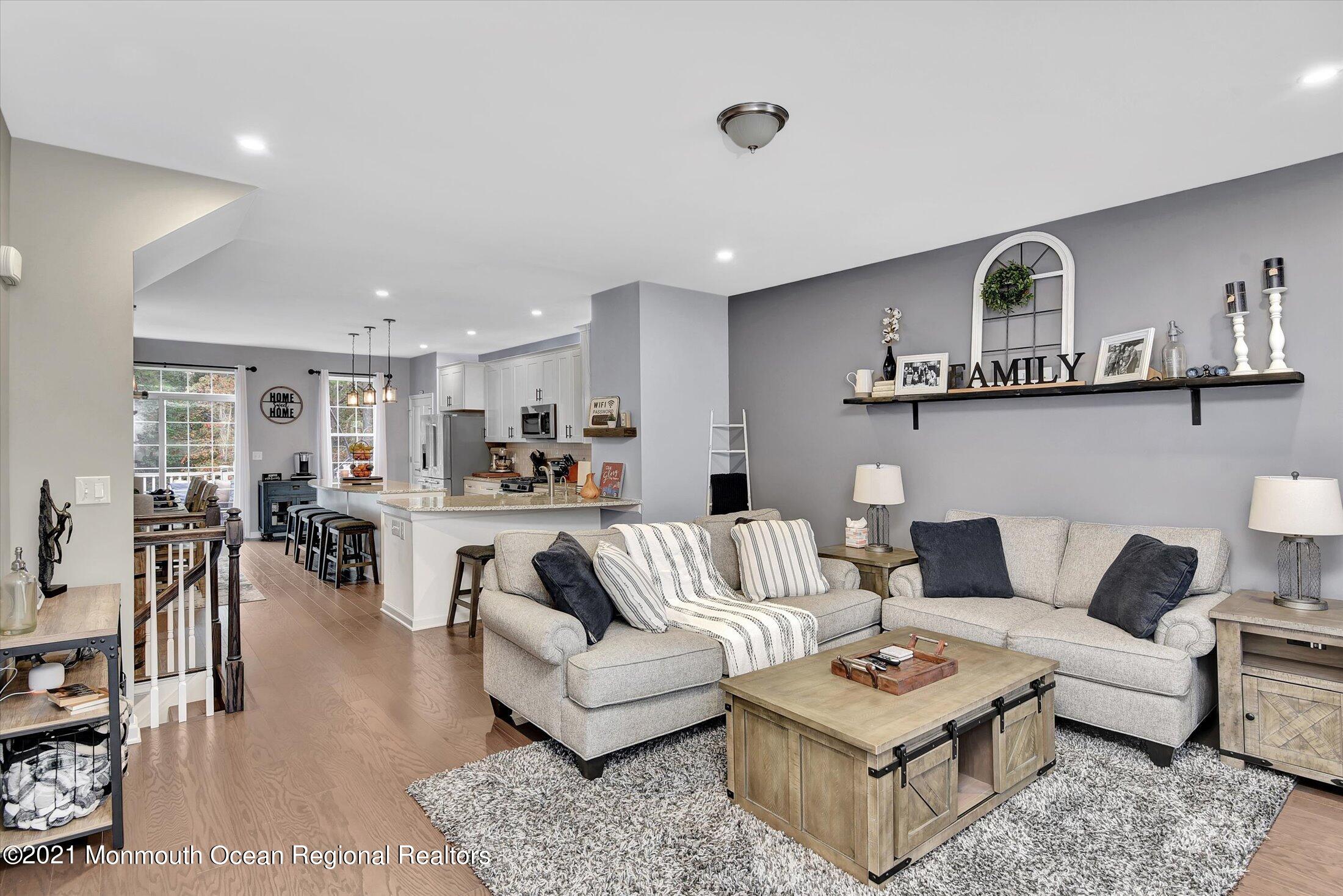 112 Revival Road, Unit 2012 Brick, NJ 08723 - Photo 7 of 22 a living room with furniture and view of kitchen