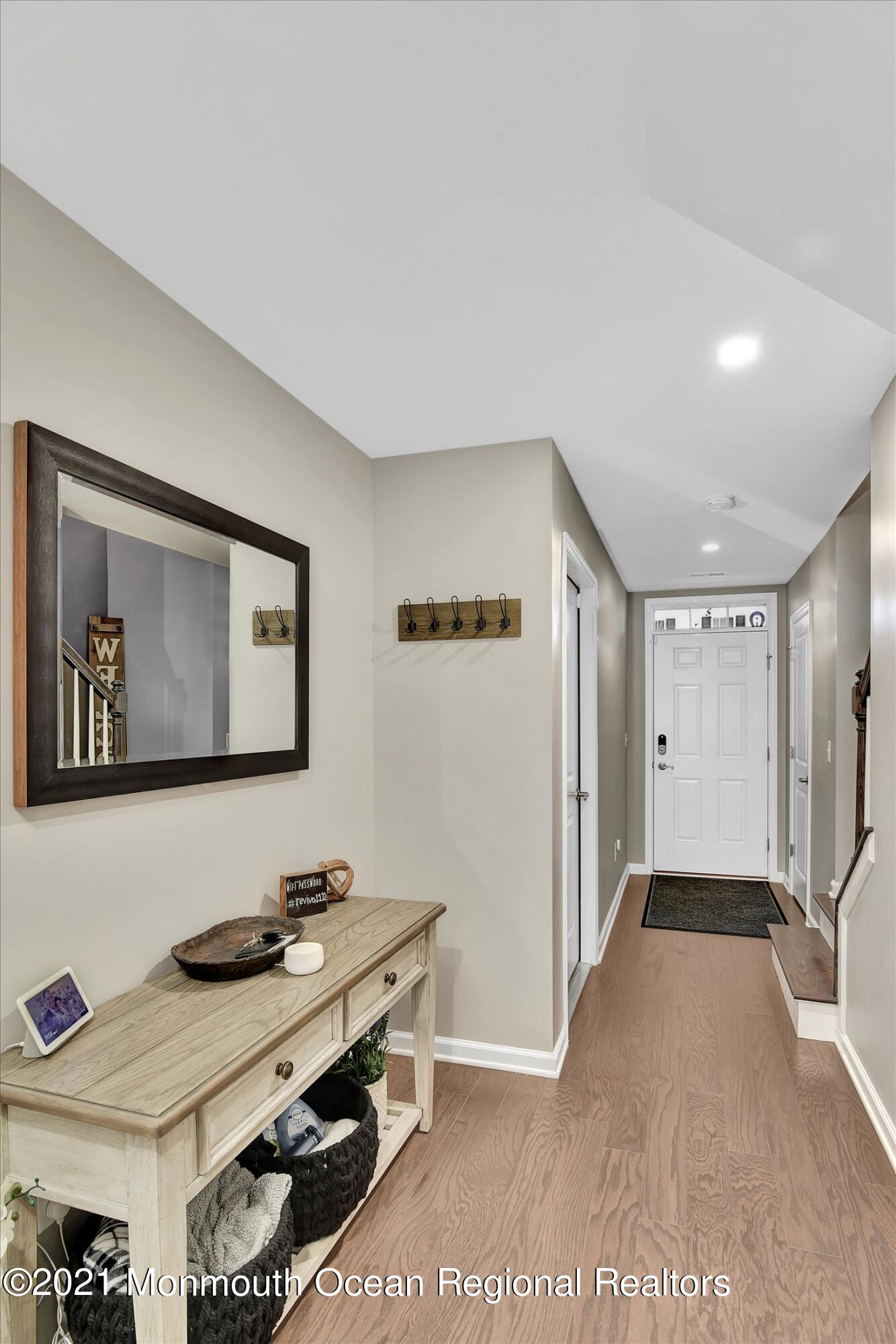 112 Revival Road, Unit 2012 Brick, NJ 08723 - Photo 10 of 22 a view of a hallway with workspace