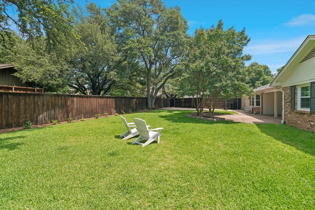 11439 Rosser Road Dallas, TX 75229 - Photo 4 of 35 a view of a garden with a slide