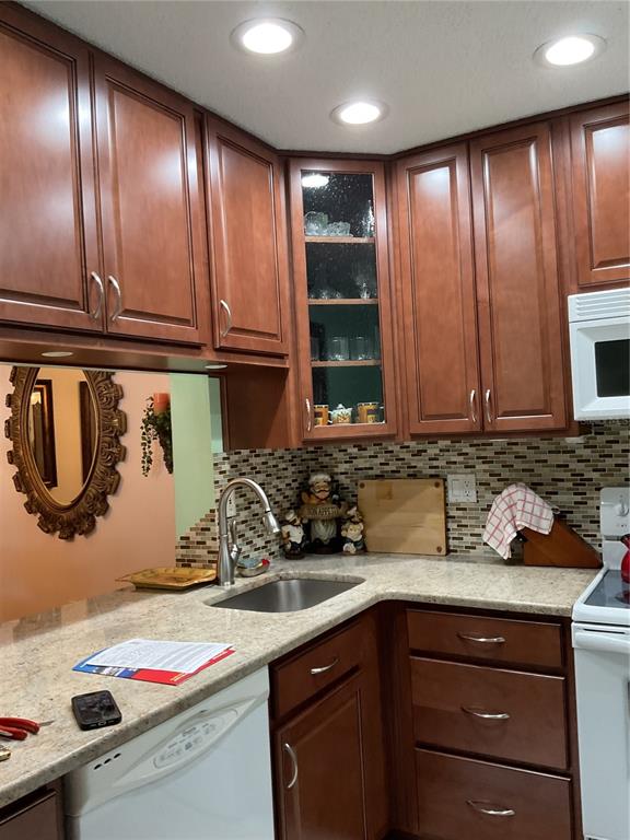 2655 Pine Ridge Way North, Unit D3 Palm Harbor, FL 34684 - Photo 12 of 31 a kitchen with a sink and cabinets