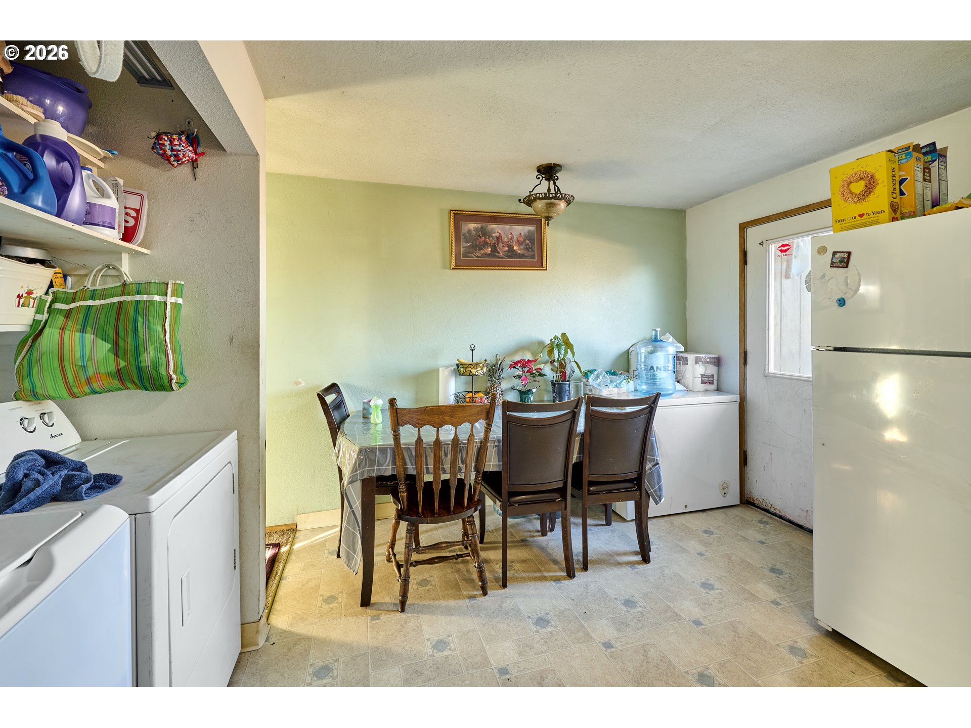 880 North Pershing Street Mount Angel, OR 97362 - Photo 10 of 30 a dining room with furniture and a kitchen view