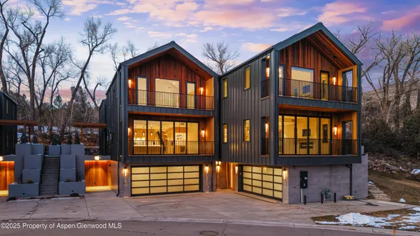 a large room with lots of counter space and wooden floor