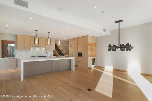 a bathroom with a glass shower door and a mirror