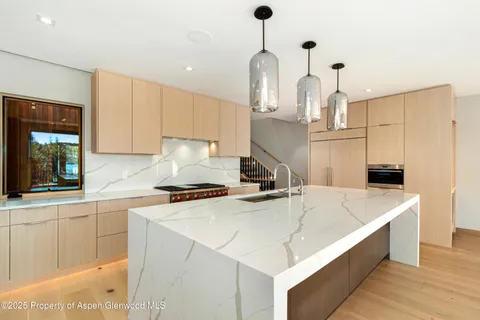 a front view of a house with glass windows