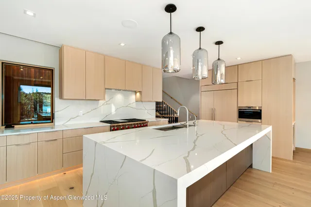 a front view of a house with glass windows