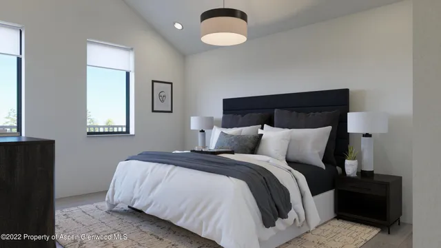 a bedroom with bed and a night stand