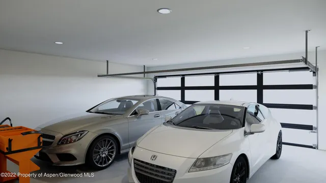 a front view of a house with car parked