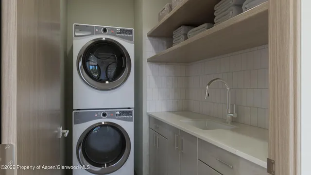 a bathroom with a sink a mirror and bathtub