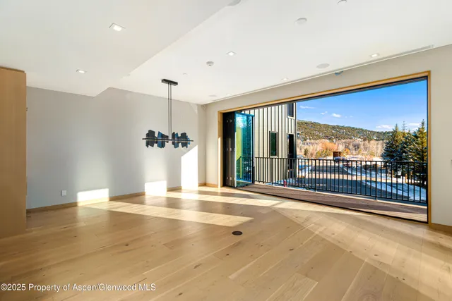 a living room with a flat screen tv and a fireplace