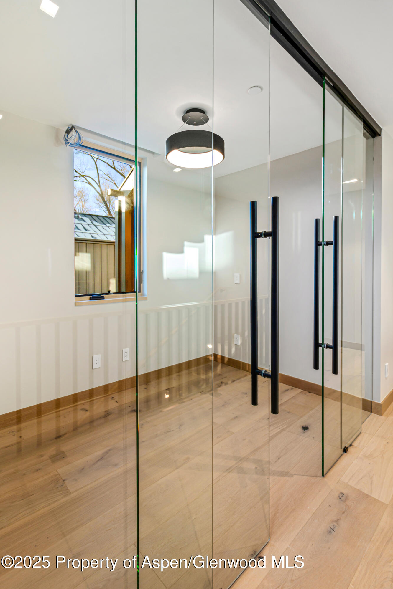 159 Lakeview Drive Basalt, CO 81621 - Photo 78 of 97 a bathroom with a glass shower door and a mirror