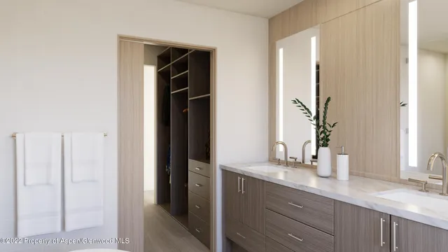 a bathroom with a double vanity sink and a mirror