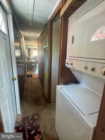 a kitchen with a stove a sink and a refrigerator