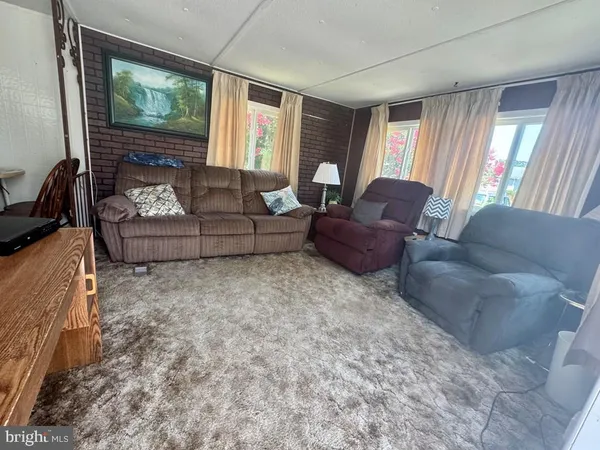 a living room with a couch and a table
