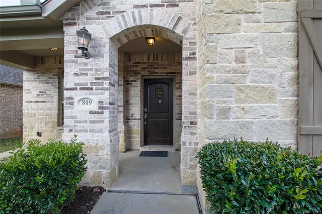 a brick building with a door