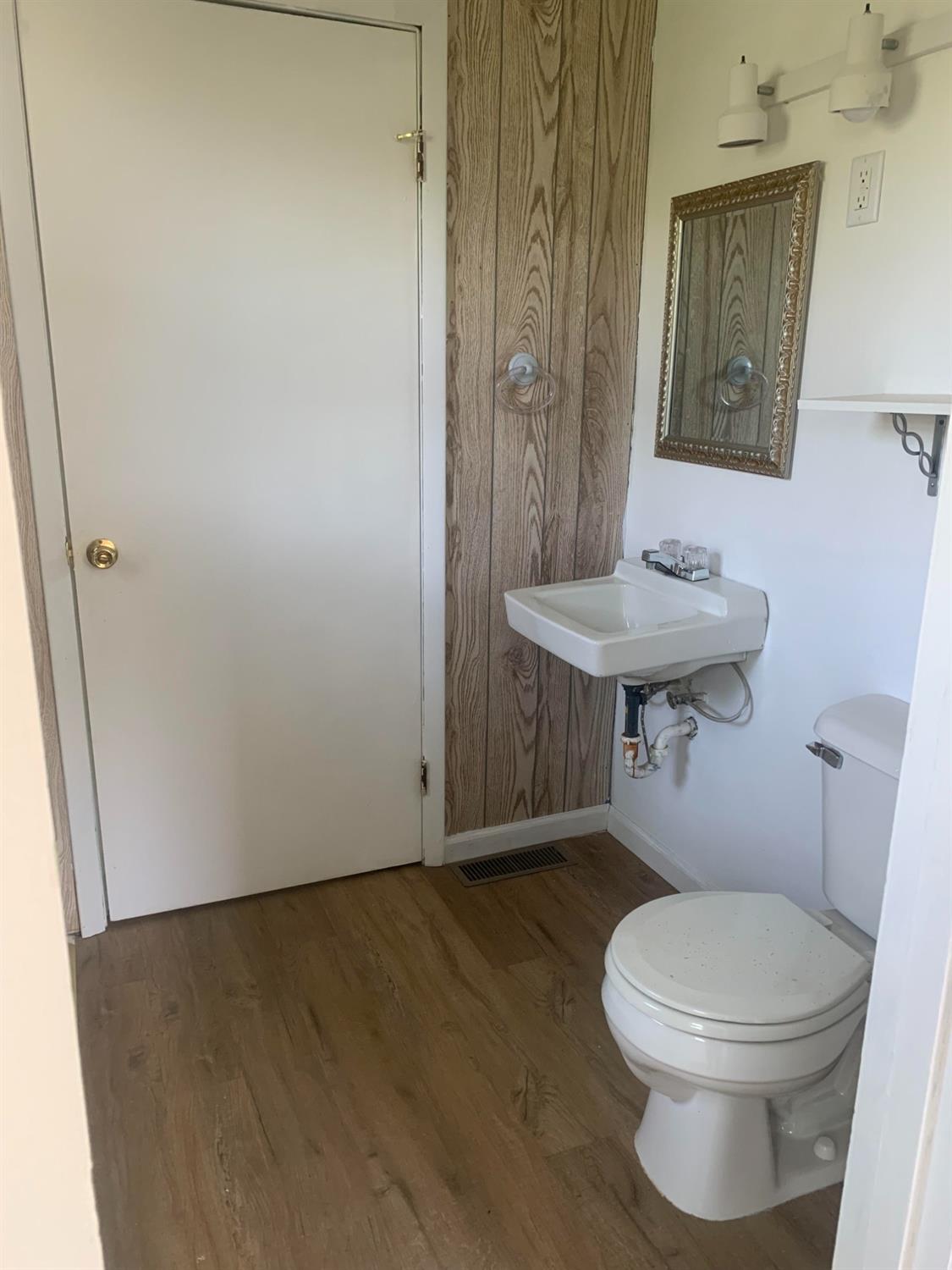 710 Coventry Road Valparaiso, IN 46385 - Photo 15 of 21 a bathroom with a sink a toilet and a mirror