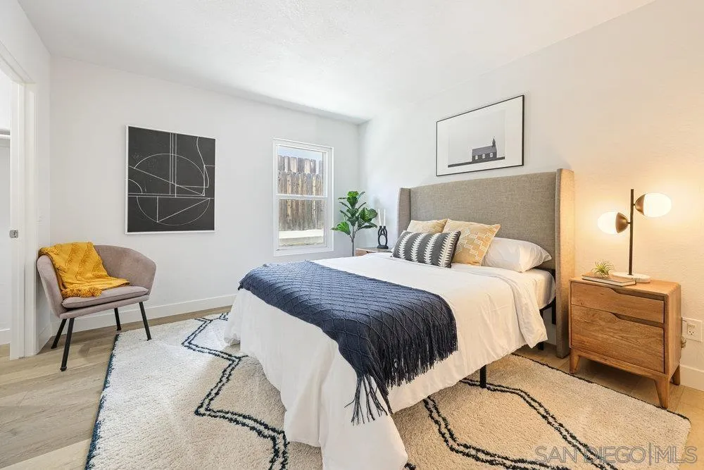 1636 Arabian Way Oceanside, CA 92057 - Photo 12 of 21 a bedroom with a bed and a couch