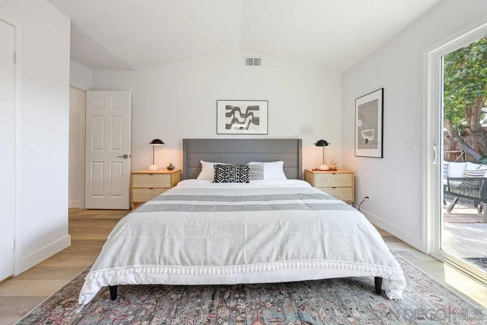 1636 Arabian Way Oceanside, CA 92057 - Photo 15 of 21 a bedroom with a bed and wooden floor