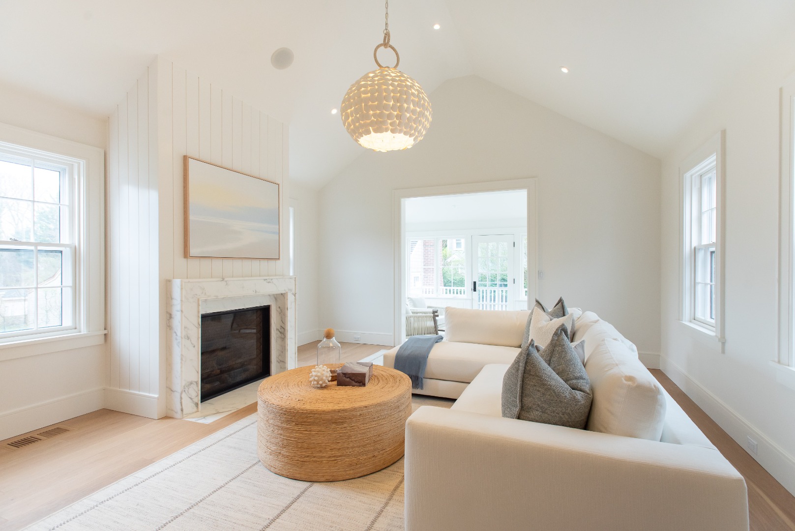 10 Silver Street Nantucket, MA 02554 - Photo 20 of 48 a living room with furniture a chandelier and a fireplace