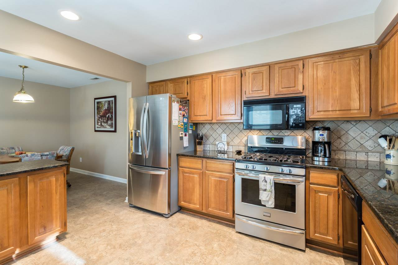6705 Twin Tree Court Raleigh, NC 27613 - Photo 6 of 20 Great updated kitchen with gas cooktop, tile back splash and granite counters! Kitchen