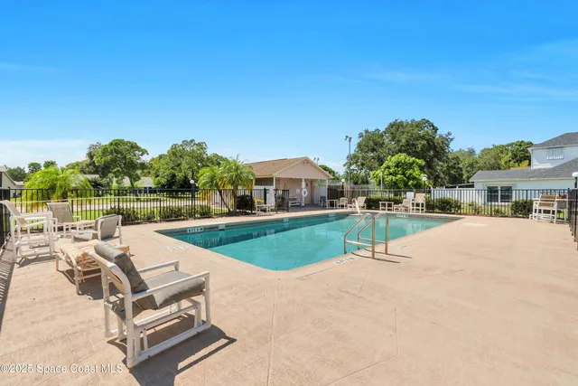 a view of swimming pool with a yard