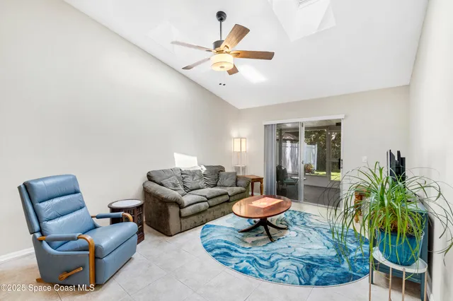 a living room with furniture and a rug