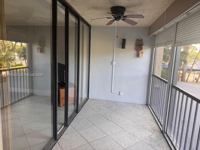 16300 Golf Club Road, Unit 208 Weston, FL 33326 - Photo 7 of 24 a view of a hallway with a chandelier