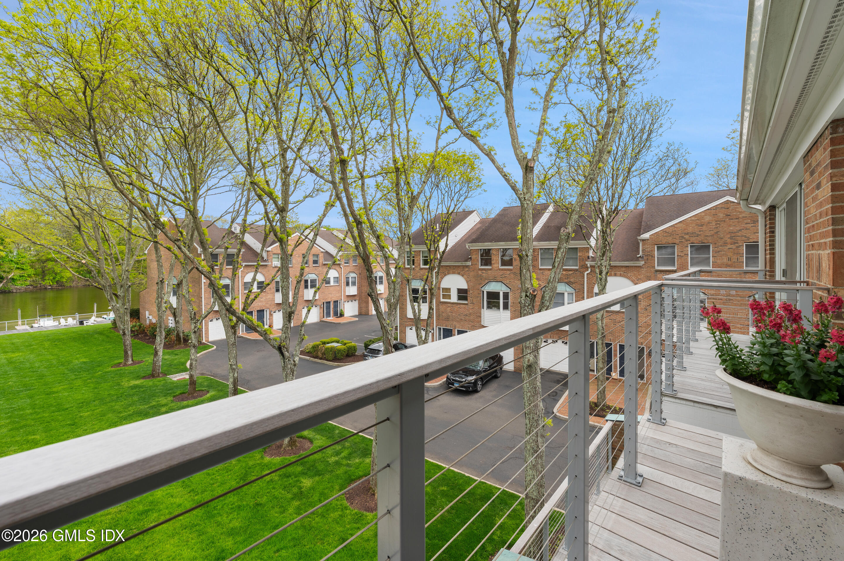 115 River Road, Unit 3 Cos Cob, CT 06807 - Photo 37 of 40 a view of a balcony with wooden stairs