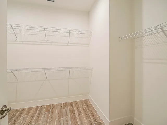 a view of a room with racks on the wall