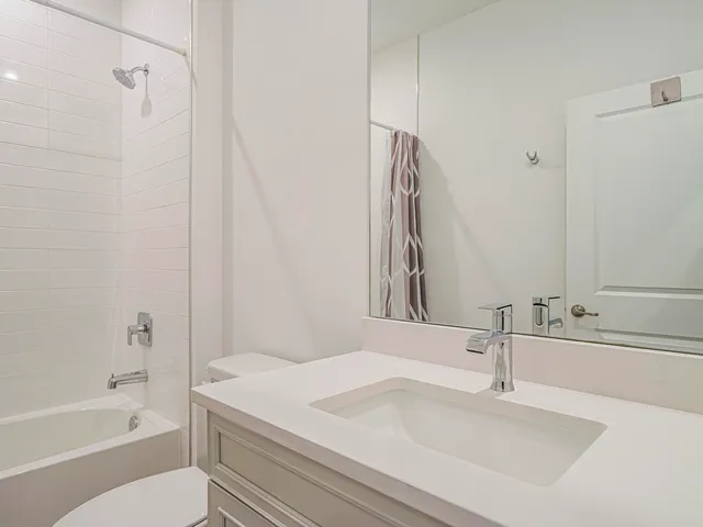 a bathroom with a sink a toilet and a bathtub