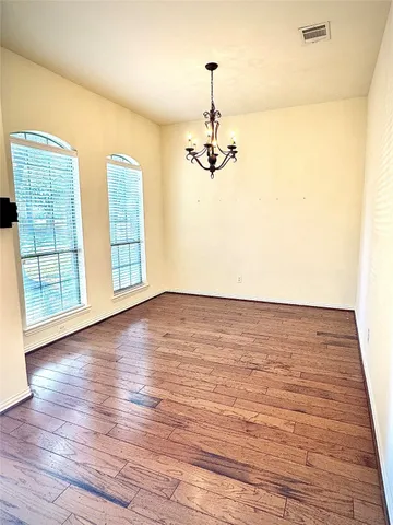 a view of kitchen with stove top oven and cabinets