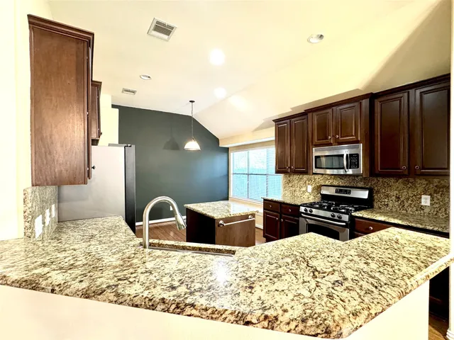 a living room with furniture fireplace and flat screen tv