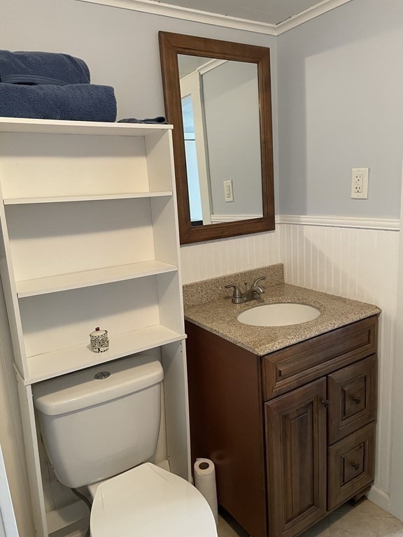 20 Cherry Street Hudson, MA 01749 - Photo 12 of 21 a bathroom with a granite countertop toilet sink and mirror