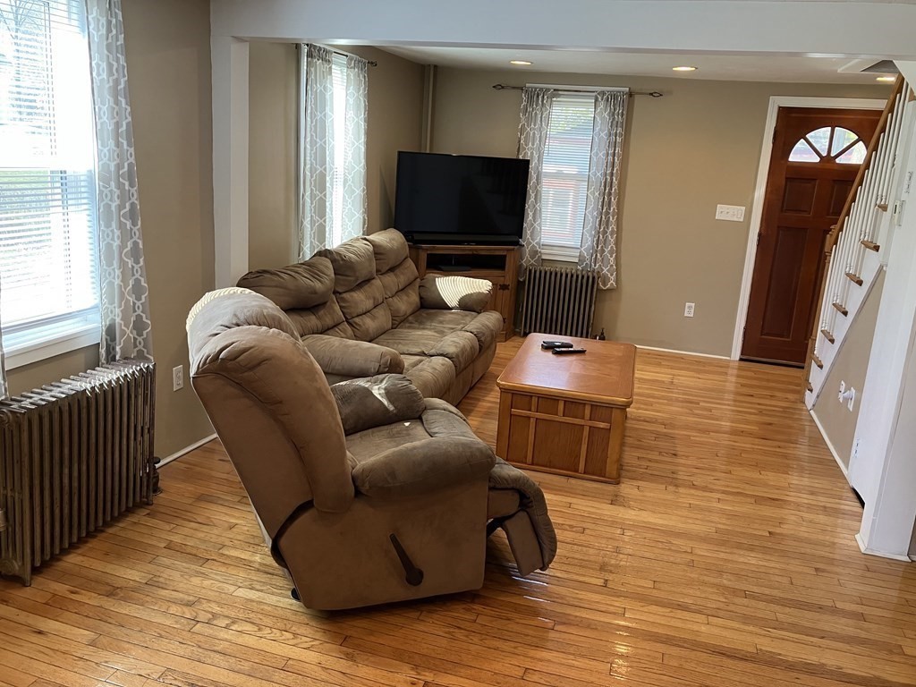 20 Cherry Street Hudson, MA 01749 - Photo 3 of 21 a living room with furniture and a flat screen tv
