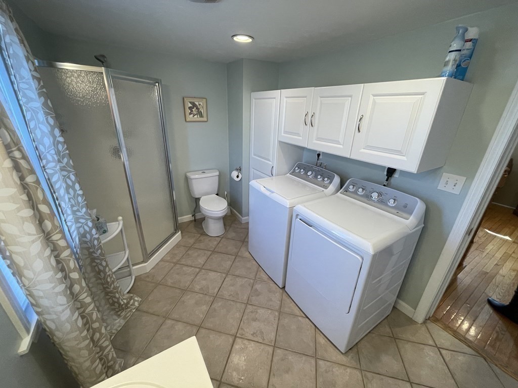 20 Cherry Street Hudson, MA 01749 - Photo 7 of 21 a bathroom with a sink a toilet and a mirror