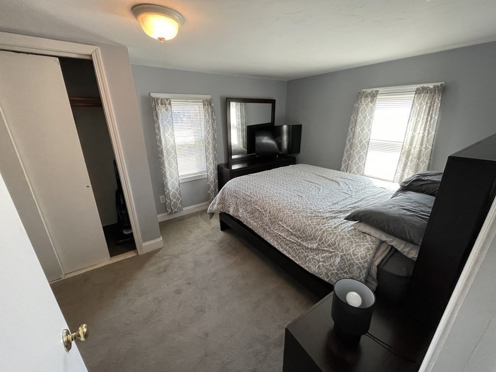 20 Cherry Street Hudson, MA 01749 - Photo 8 of 21 a bedroom with a bed and a window