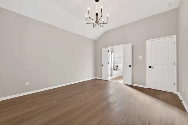 a bathroom with a bathtub shower sink vanity and toilet