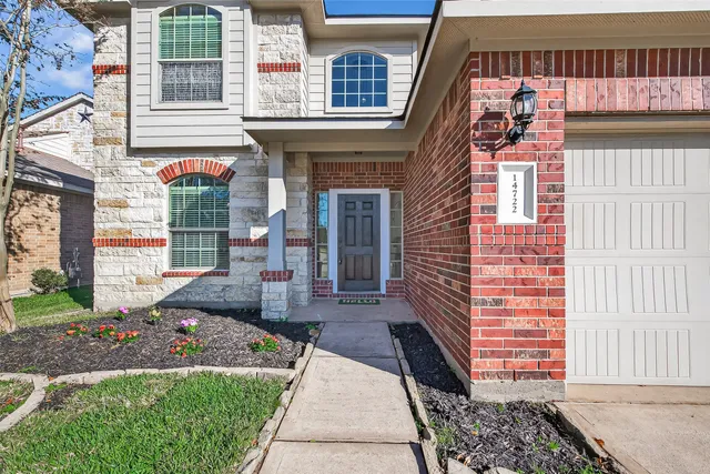 a view of empty room with window and cabinet