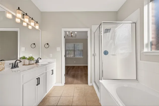a view of a room with wooden floor and windows in it